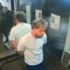 Eric Christian Hernandez virou réu após agredir a namorada em elevador de prédio em Botafogo, RJ. Passaporte segue retido até conclusão da instrução.